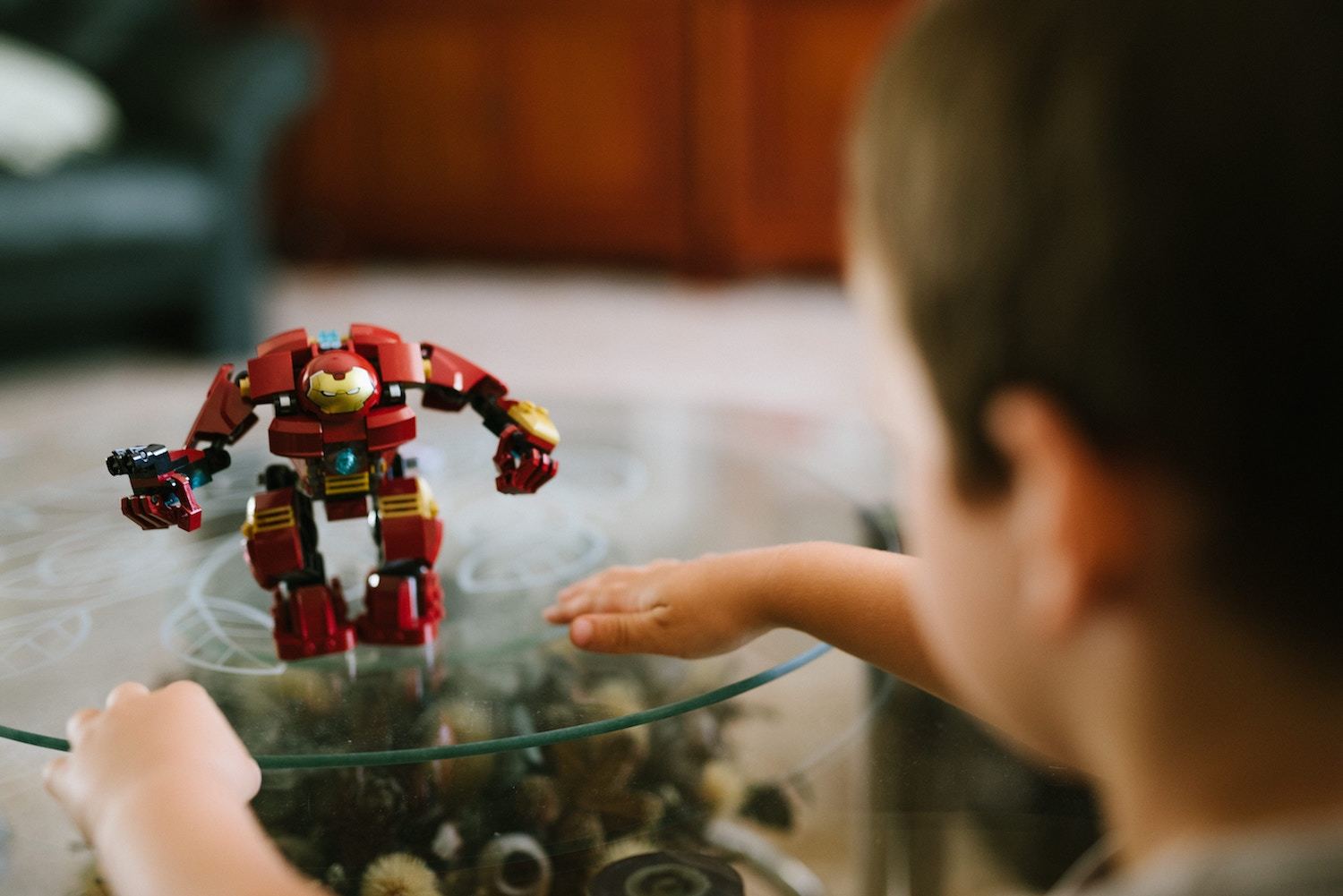 An Iron Man toy sits on a table
