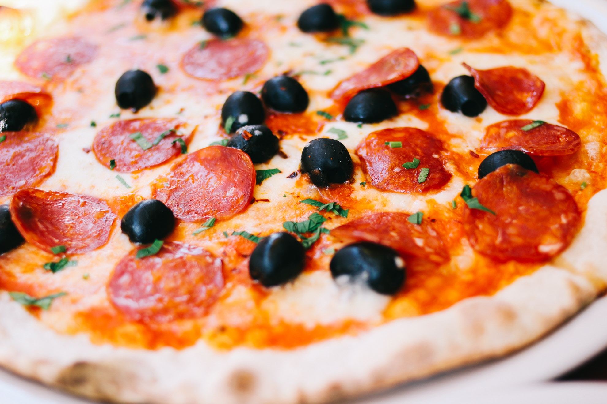 Pepperoni and black olive pizza