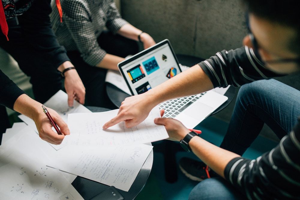 A team collaborates around a table