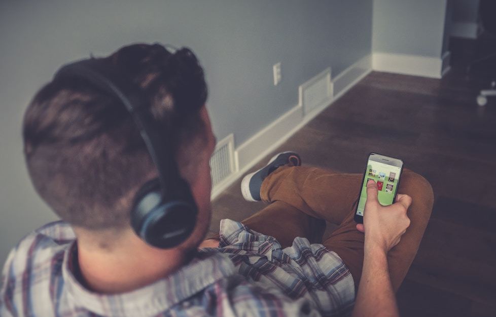 Man on cell phone with headphones