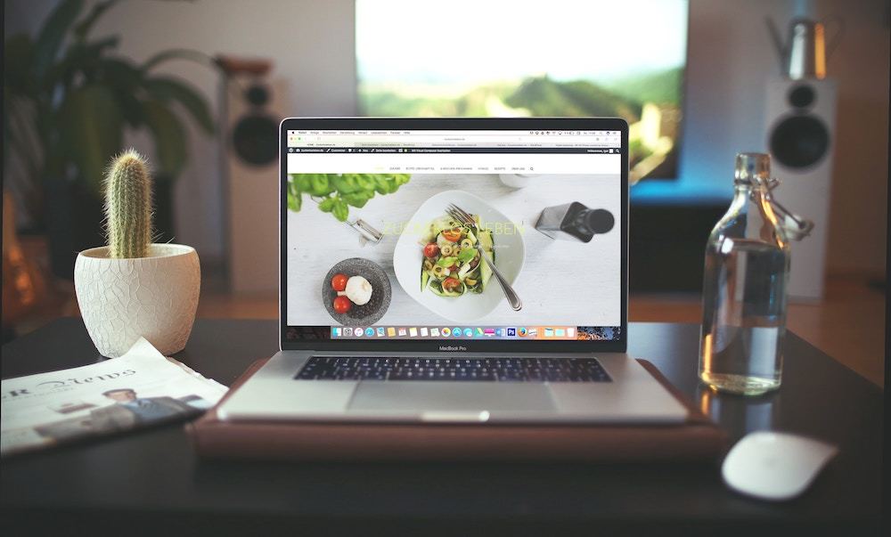 A laptop open to a web browser sitting on a desk