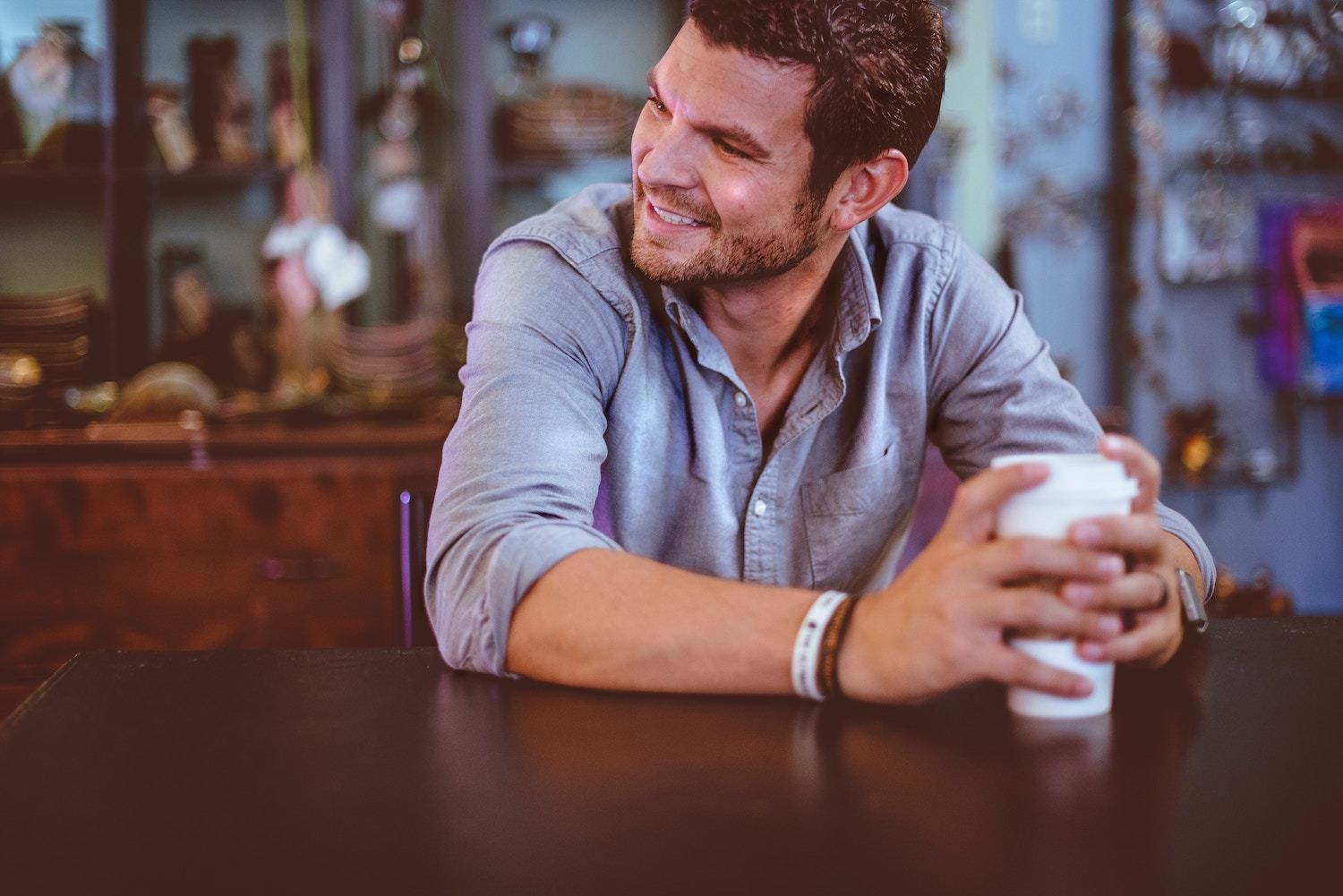 Smiling man with coffee cup