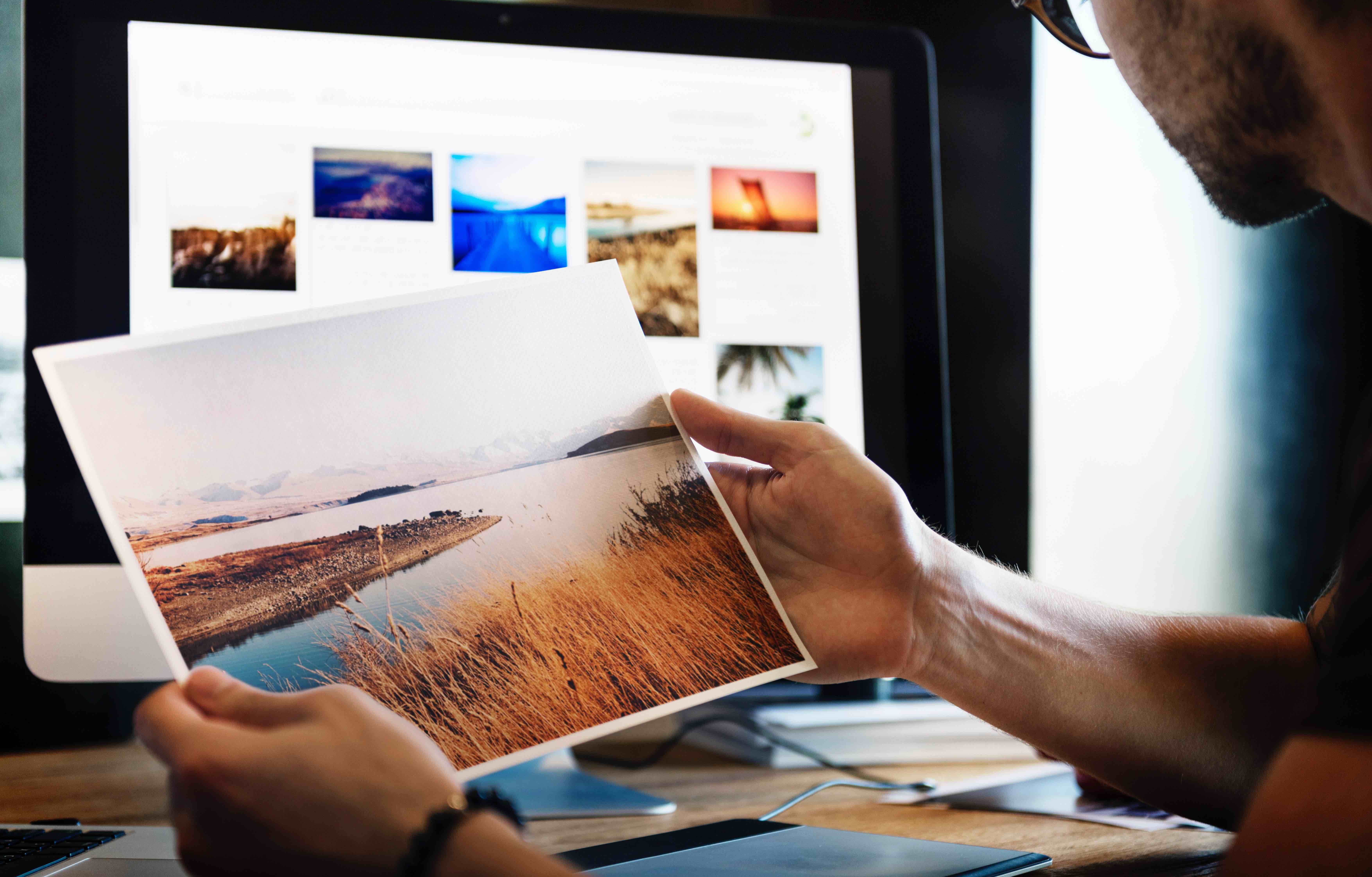 man holding photograph