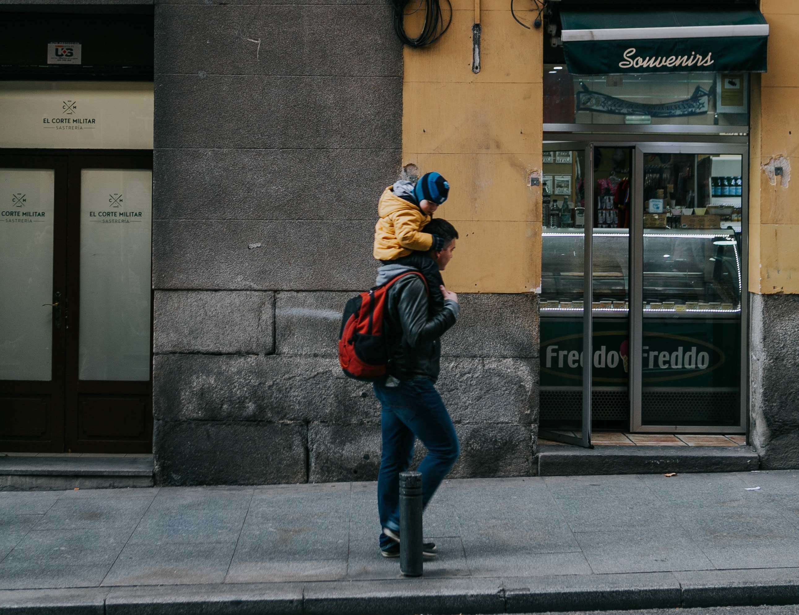 Father walking with son on his shoulders