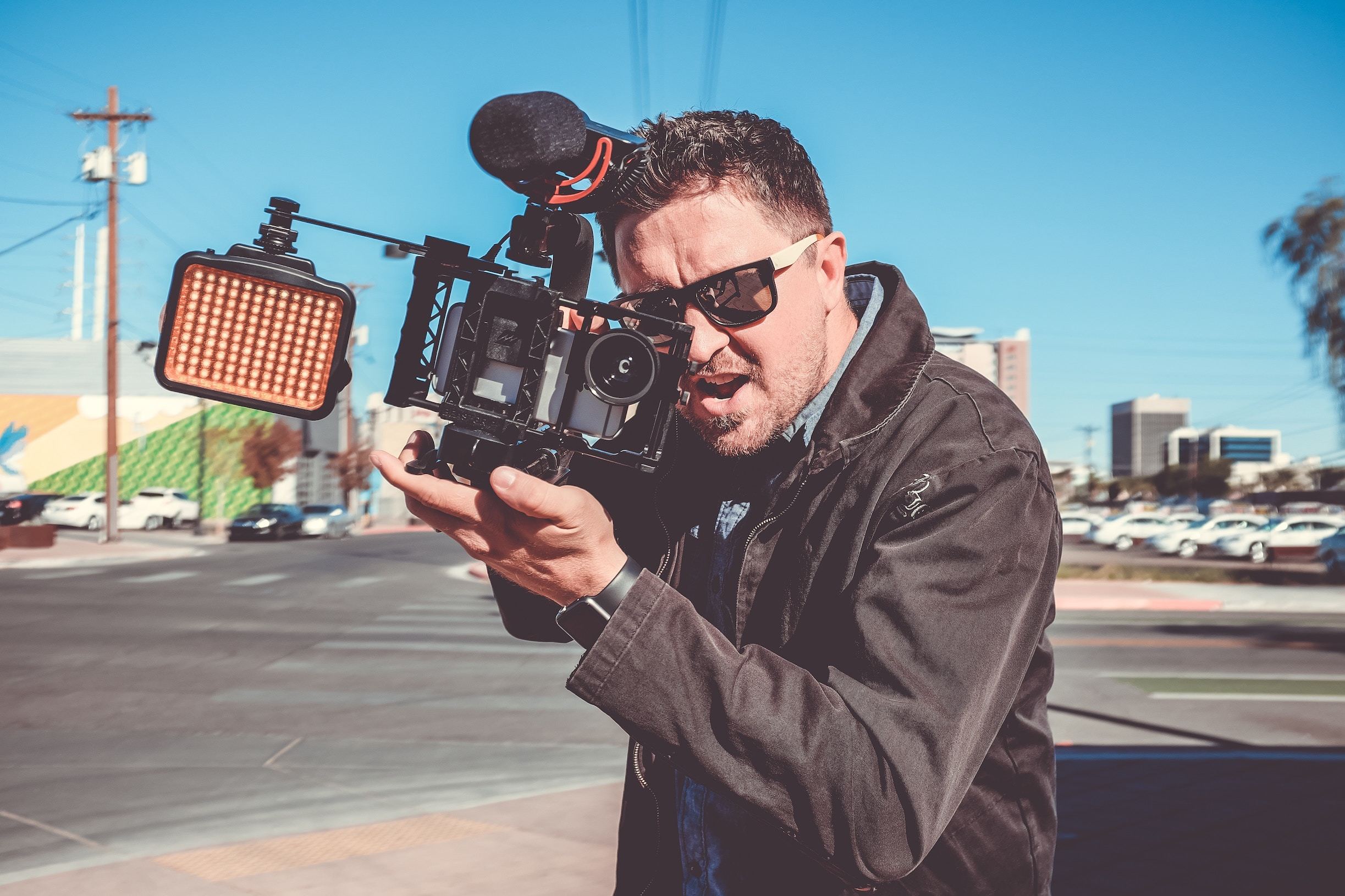 Man with camera looking aggressive