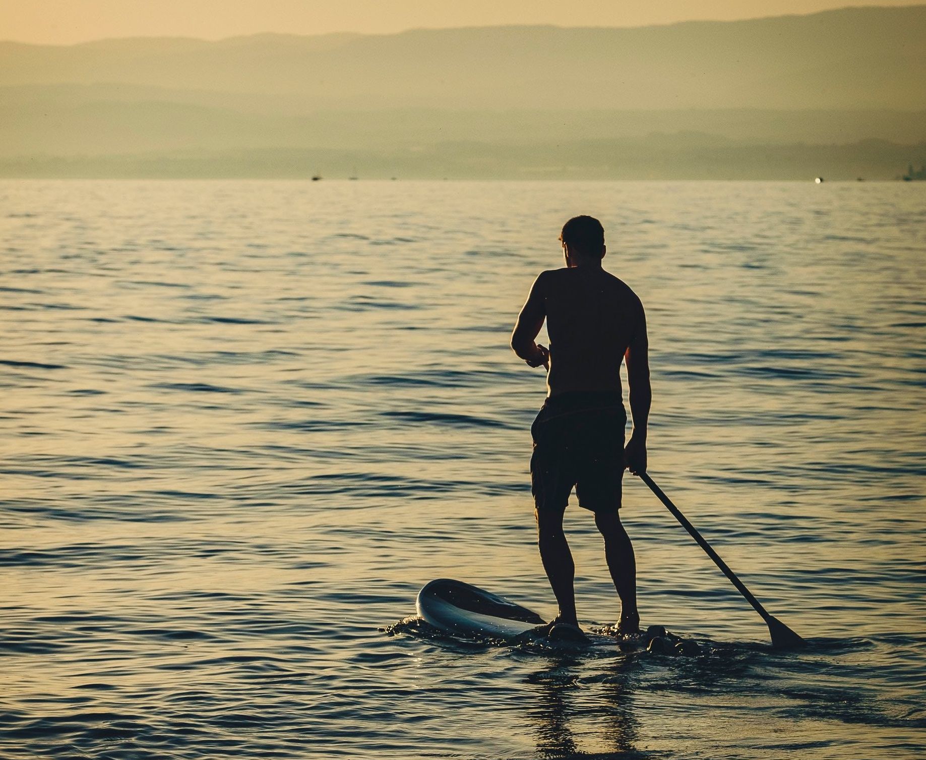 sunset paddle boarding