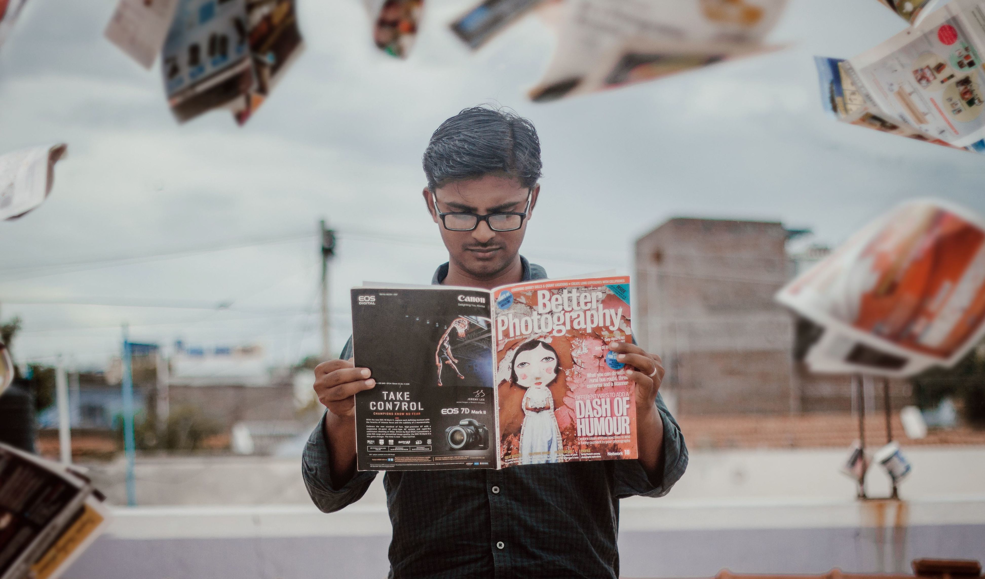 man reading a magazine