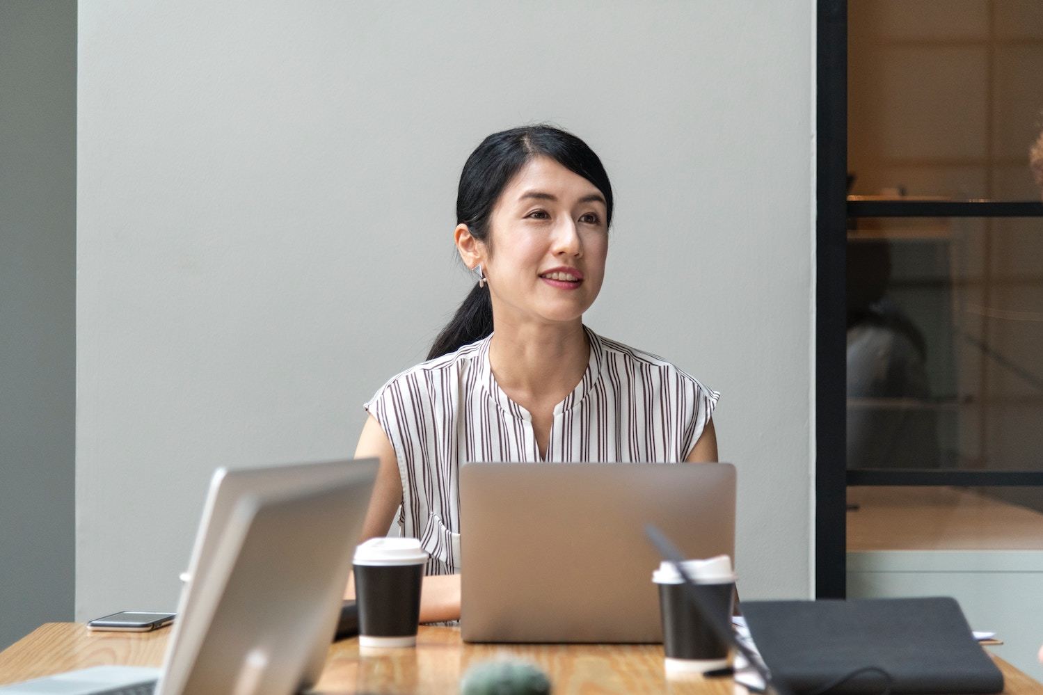 Woman presents at business meeting