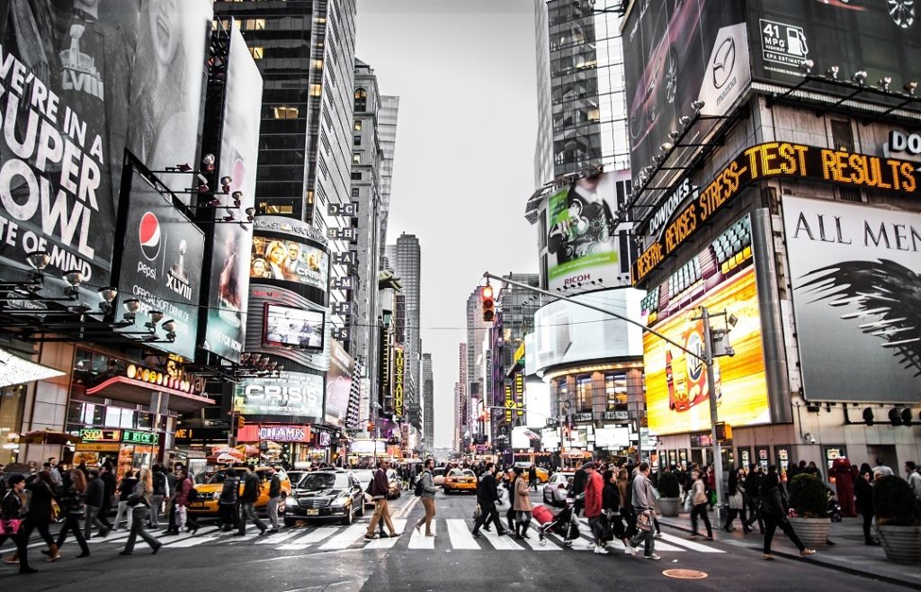 People walking past ads in Times Square