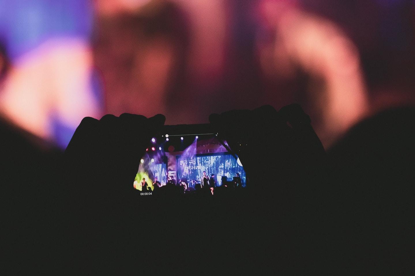 Phone held up to record concert