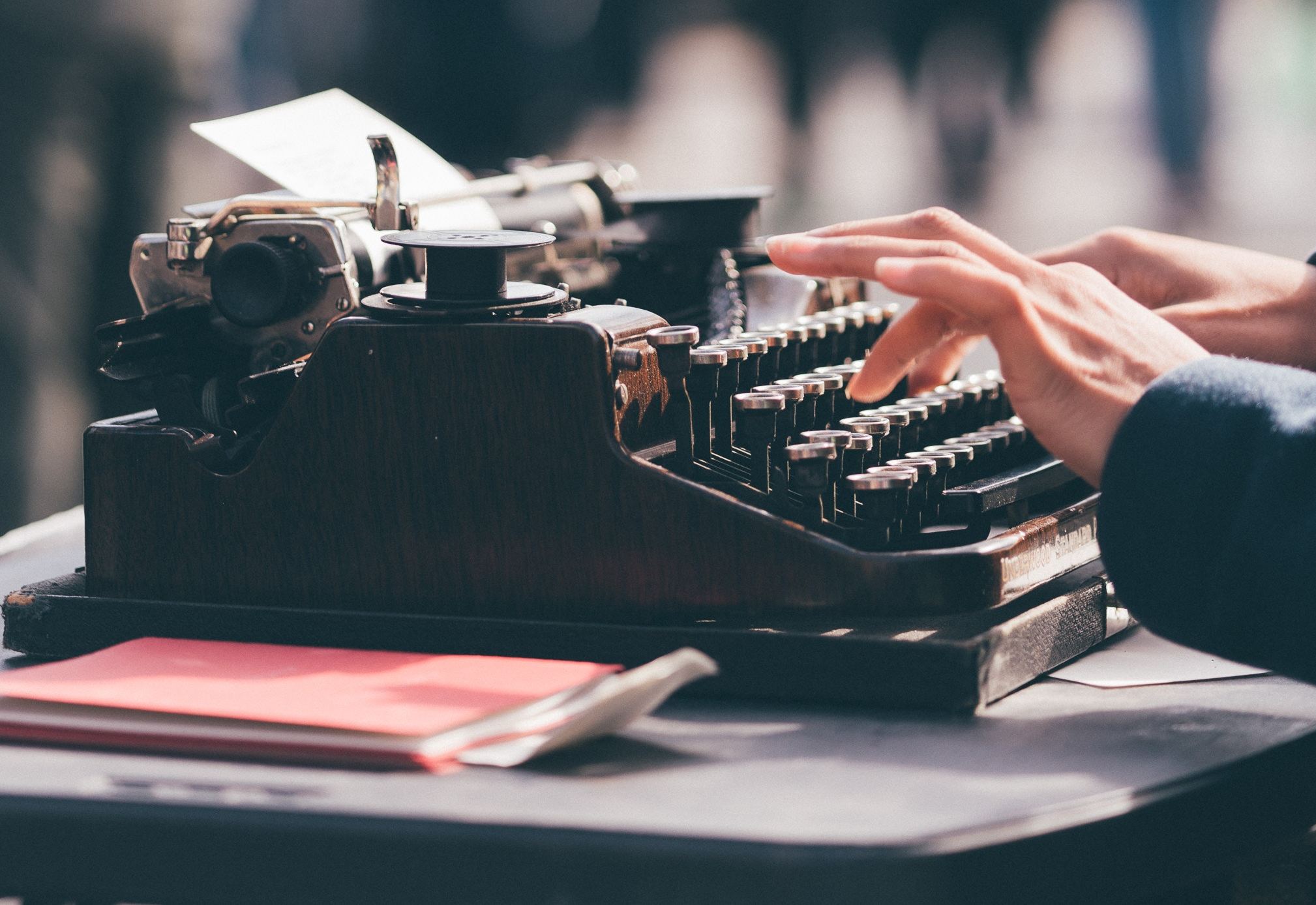 hands typing on typewriter (side view)