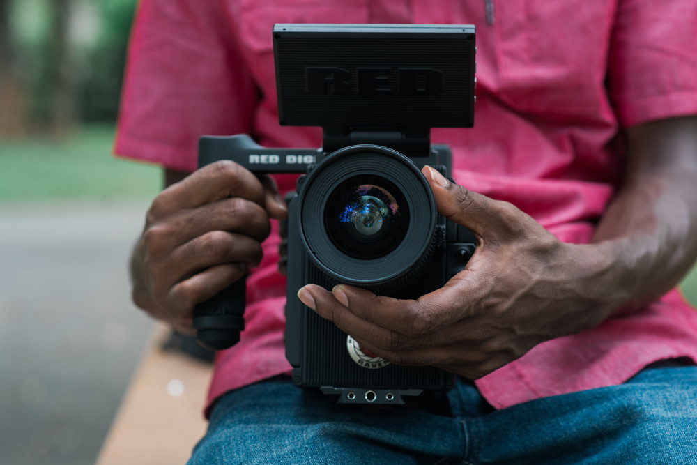 A videographer prepares to record the subject of an interview.