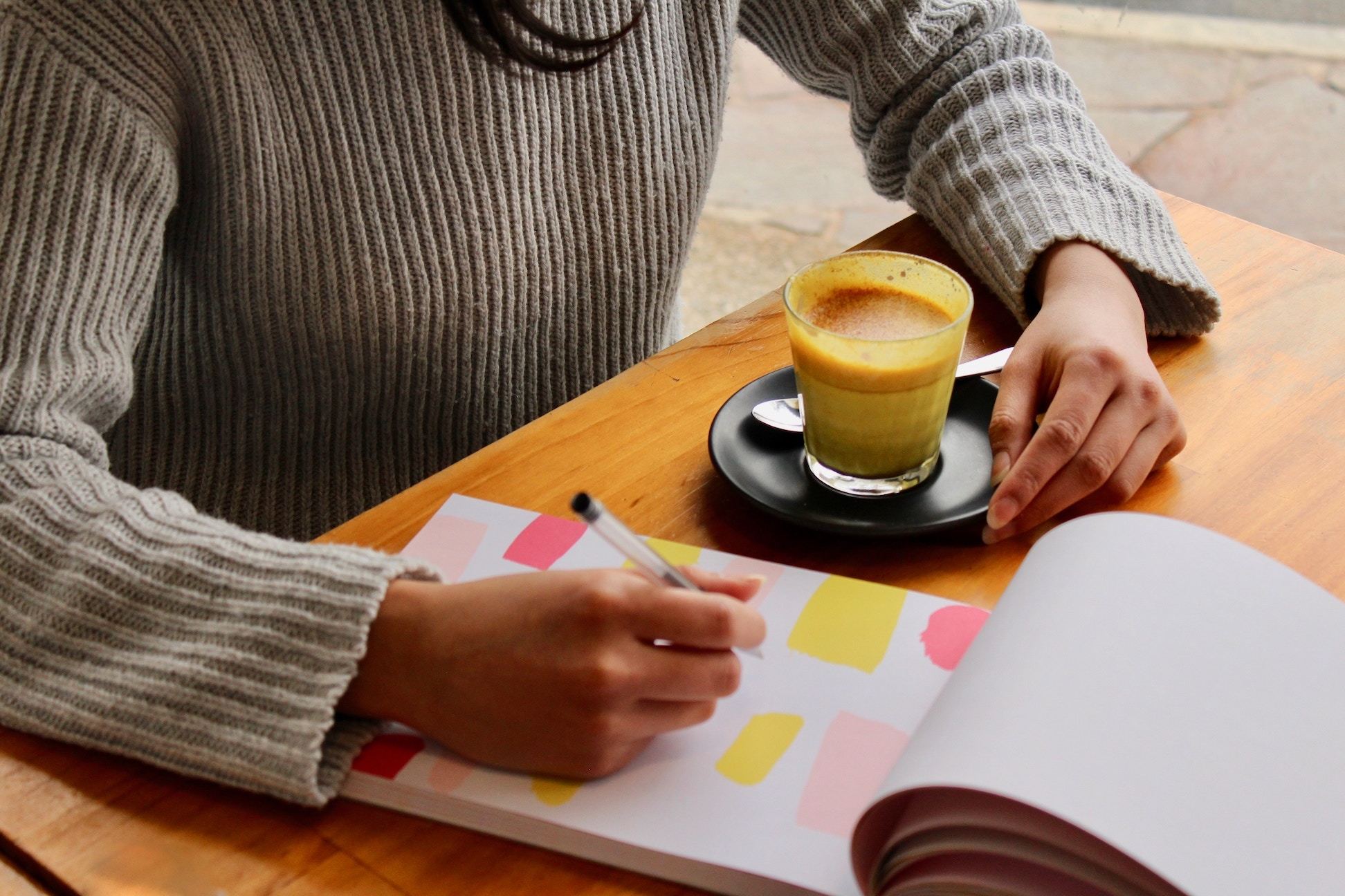 Woman with planning notebook and coffee