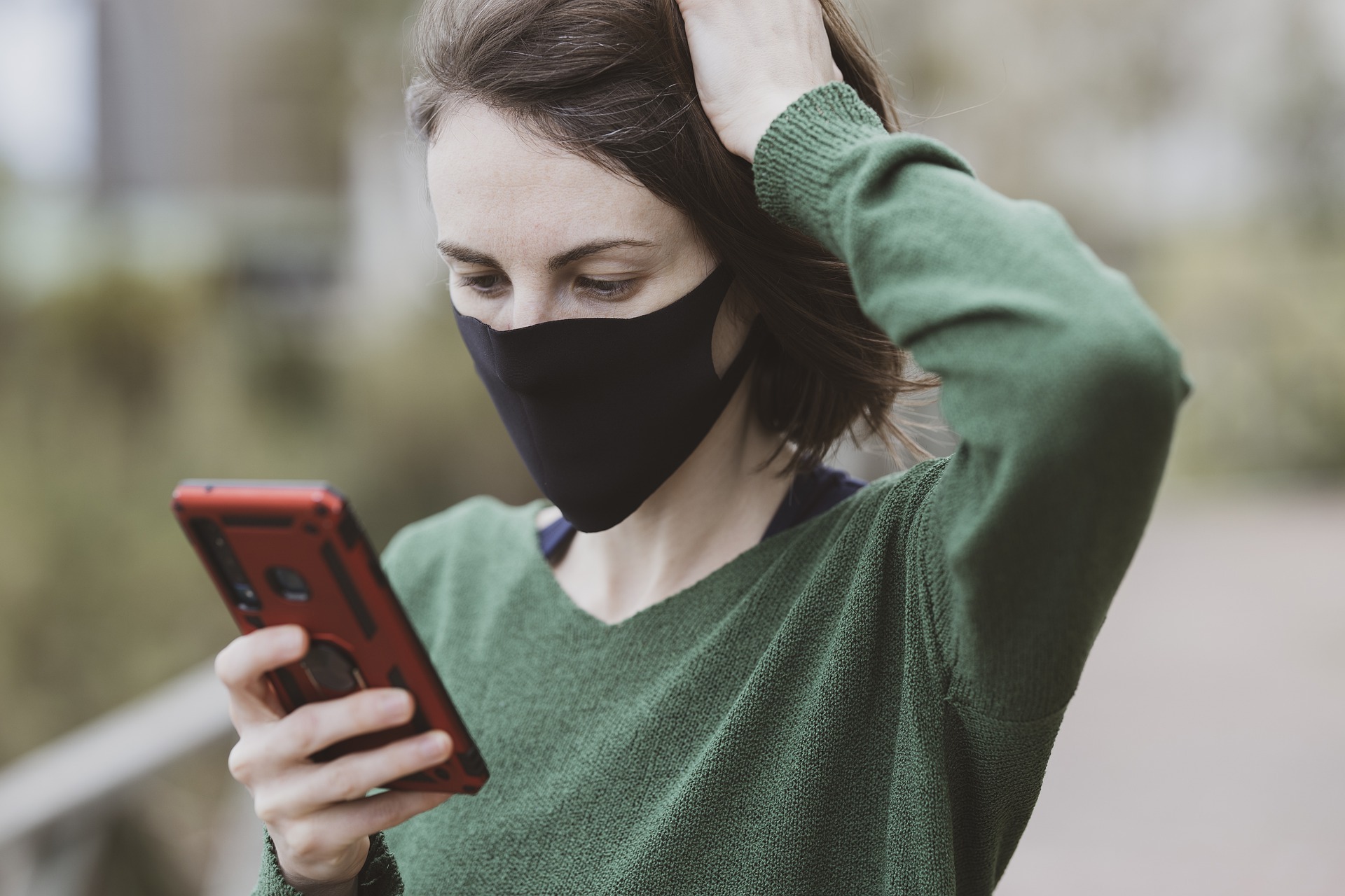 Masked girl with phone