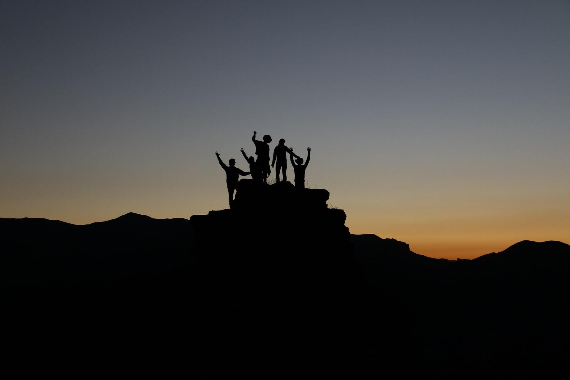 Team reaching the summit together